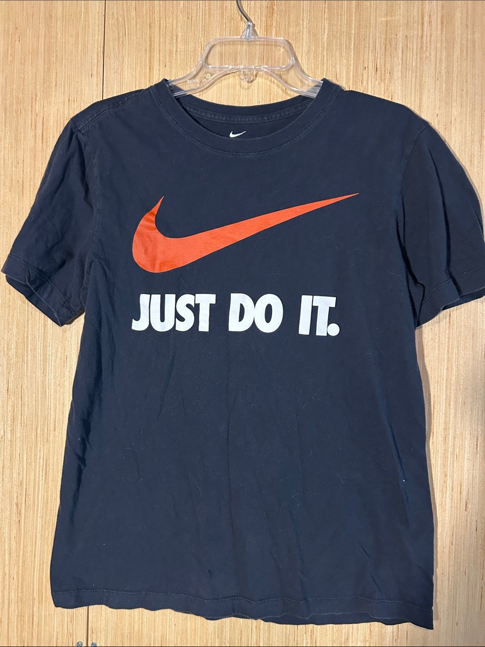 Nike Black T‑Shirt with Orange Swoosh and White Logo